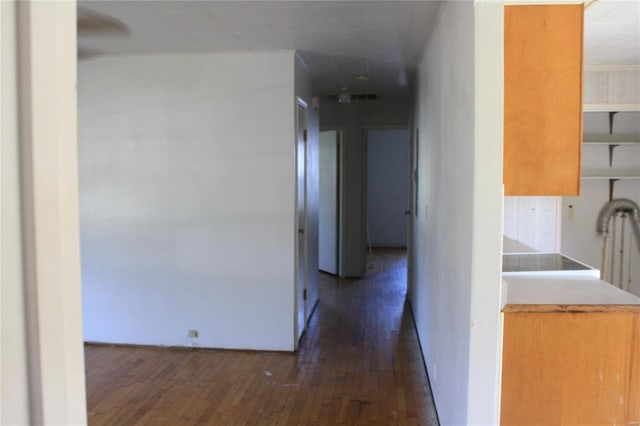 corridor featuring dark hardwood / wood-style floors