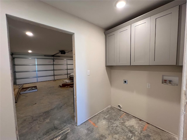 washroom featuring cabinets, hookup for a washing machine, and hookup for an electric dryer