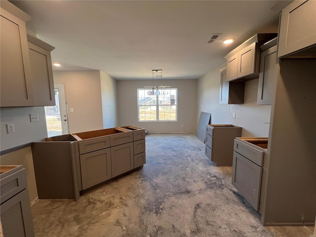 kitchen featuring gray cabinetry and decorative light fixtures