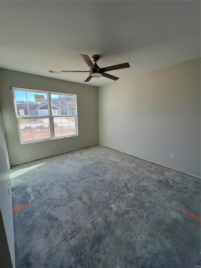 unfurnished room with ceiling fan