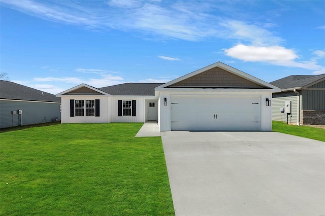 single story home with a front lawn, an attached garage, and concrete driveway