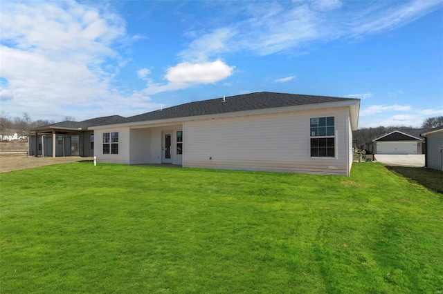 rear view of house with a yard and dirt driveway