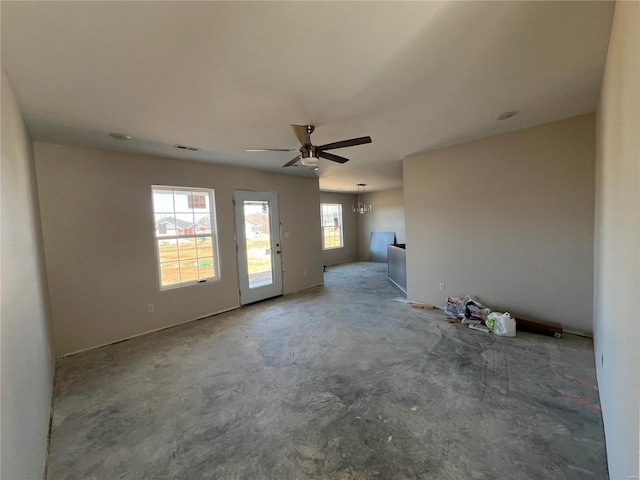 unfurnished living room featuring visible vents, concrete flooring, and a ceiling fan