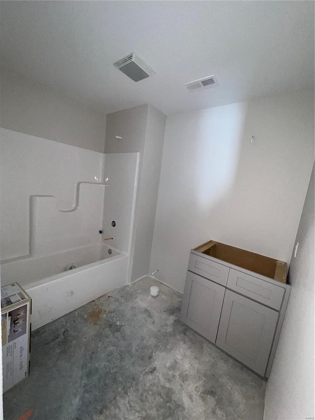 bathroom with visible vents, concrete flooring, and shower / bathing tub combination