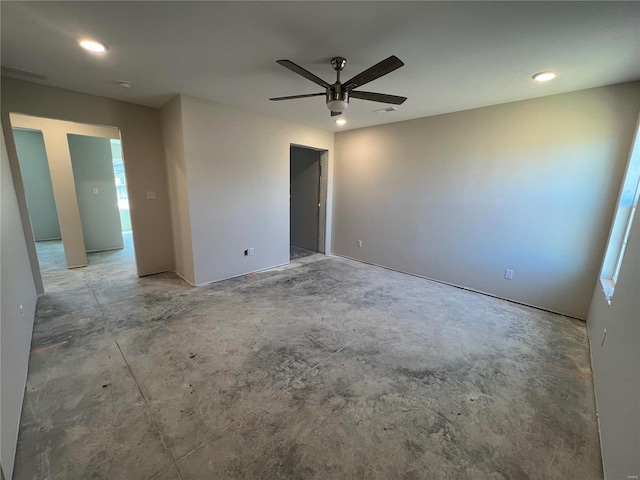 empty room with recessed lighting, concrete flooring, and ceiling fan