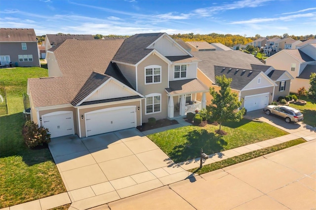 view of front property with a front lawn and a garage