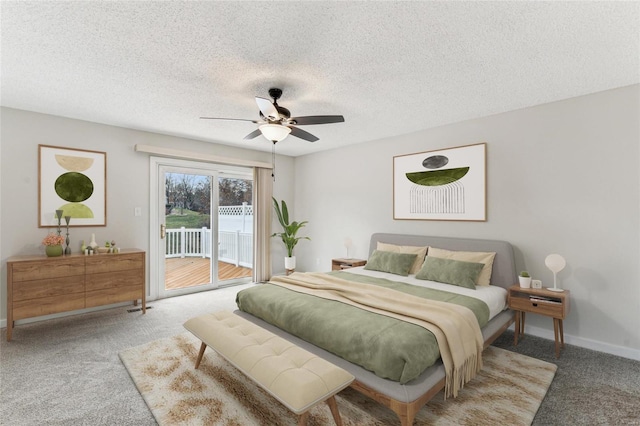 bedroom featuring ceiling fan, a textured ceiling, access to outside, and light carpet