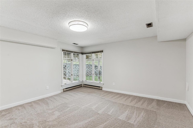 unfurnished room featuring carpet, a textured ceiling, and a baseboard radiator