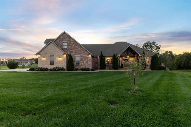 view of front of home featuring a lawn