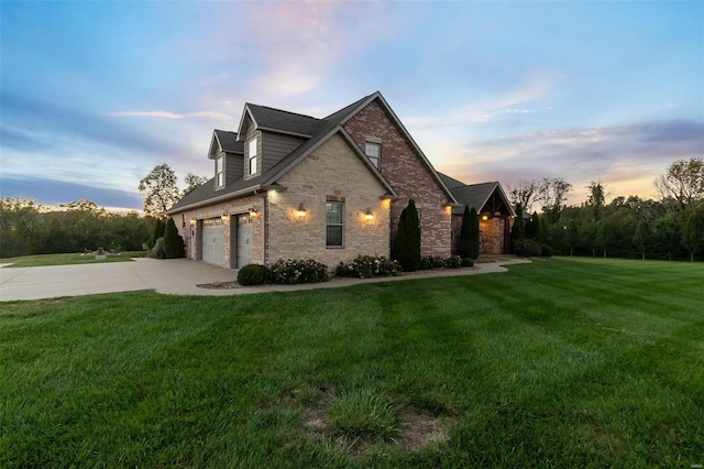 property exterior at dusk with a yard and a garage