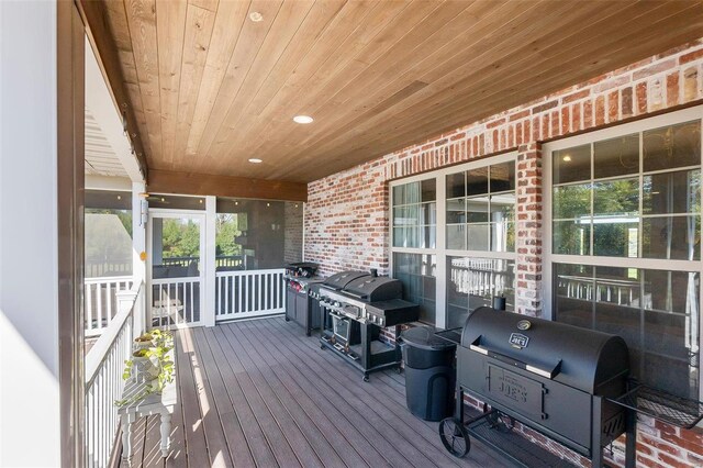 wooden terrace featuring grilling area