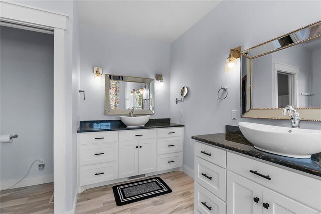 bathroom featuring vanity and hardwood / wood-style floors