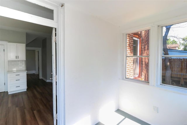 hallway with dark hardwood / wood-style floors