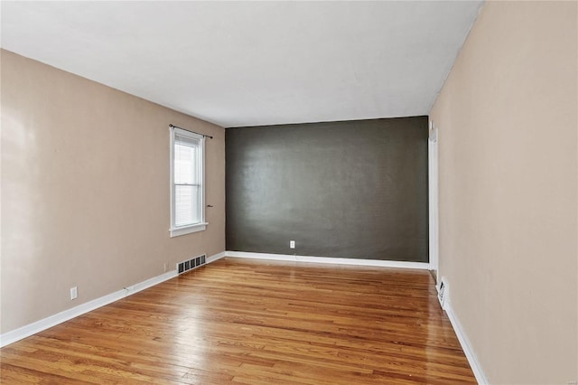 unfurnished room featuring light wood-type flooring