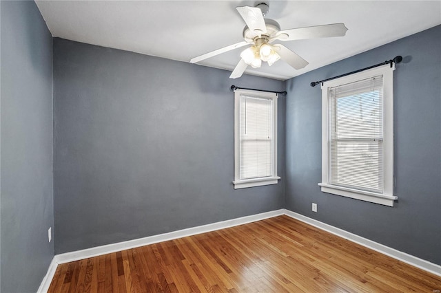 unfurnished room with ceiling fan and wood-type flooring