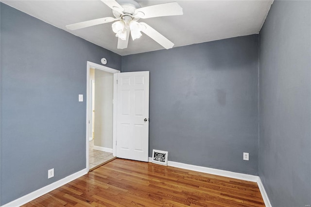 unfurnished room featuring light hardwood / wood-style floors and ceiling fan