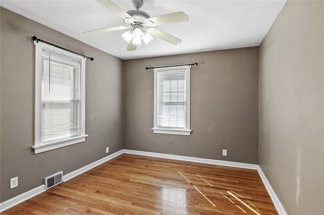 spare room with light hardwood / wood-style floors and ceiling fan