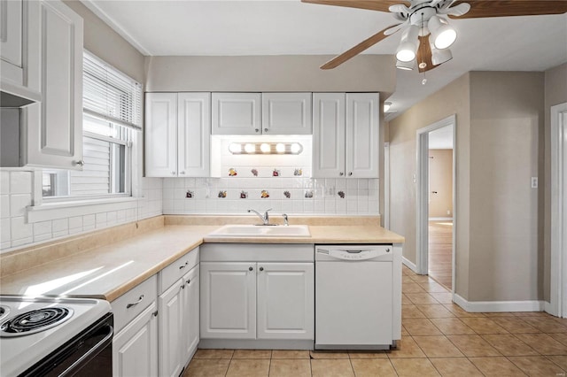 kitchen with white appliances, tasteful backsplash, sink, white cabinetry, and light tile patterned floors