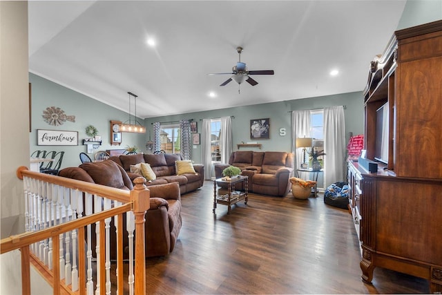 living room featuring ceiling fan, lofted ceiling, and dark hardwood / wood-style floors