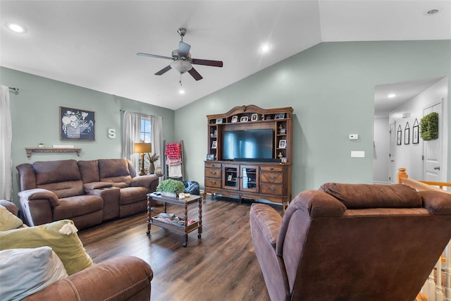 living room with lofted ceiling, dark hardwood / wood-style floors, and ceiling fan