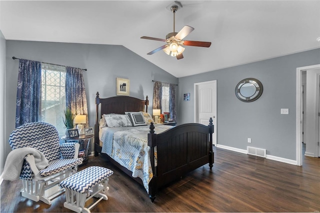 bedroom featuring dark hardwood / wood-style flooring, lofted ceiling, and ceiling fan