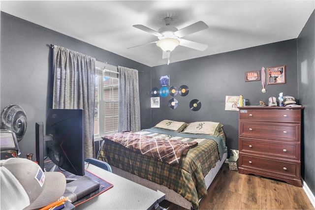 bedroom with hardwood / wood-style flooring and ceiling fan