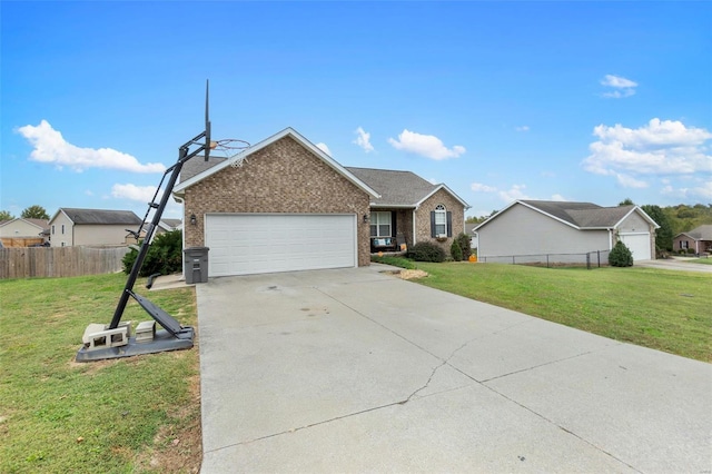 view of front of property featuring a front yard and a garage