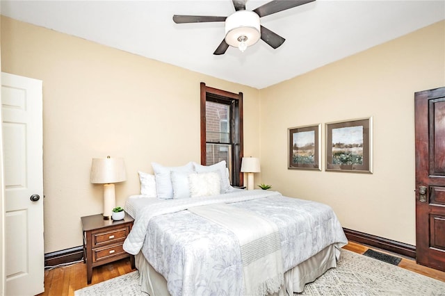 bedroom featuring light hardwood / wood-style floors and ceiling fan