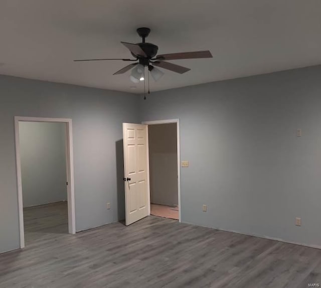 unfurnished bedroom with light hardwood / wood-style floors and ceiling fan