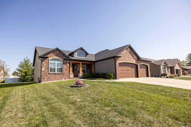 view of front of property featuring a front yard and a garage