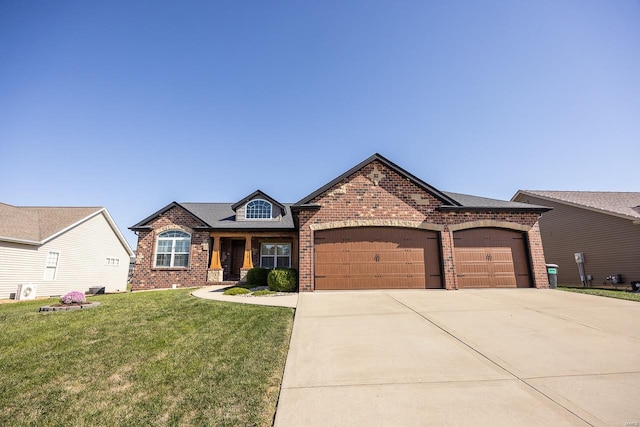 view of front of house with a front yard and a garage