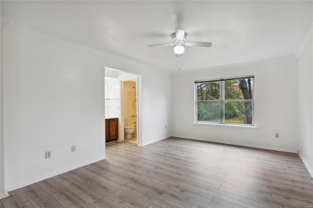 empty room featuring ceiling fan, light hardwood / wood-style flooring, and crown molding