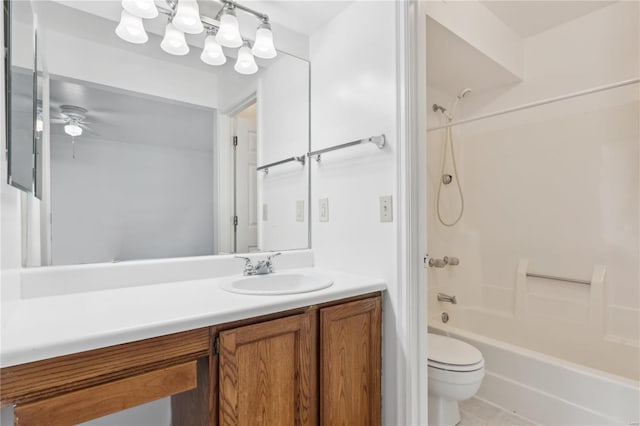 full bathroom featuring tile patterned floors, vanity, shower / washtub combination, ceiling fan, and toilet