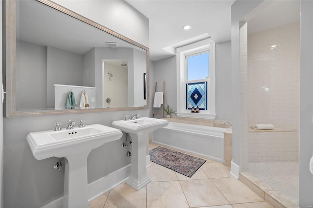 bathroom with shower with separate bathtub