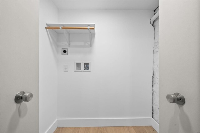 clothes washing area featuring washer hookup, hardwood / wood-style flooring, and electric dryer hookup