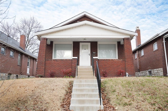 bungalow with a front yard