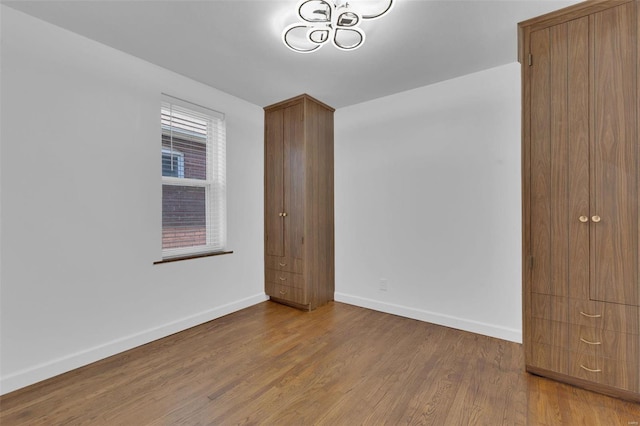 unfurnished bedroom featuring hardwood / wood-style floors