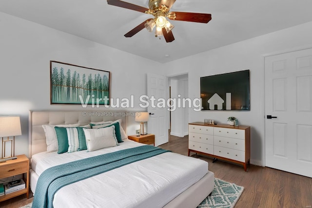 bedroom featuring ceiling fan and dark wood-type flooring