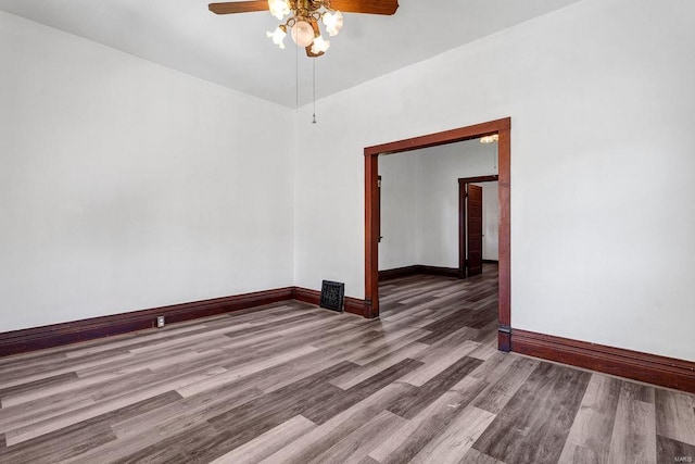 spare room featuring ceiling fan and hardwood / wood-style floors