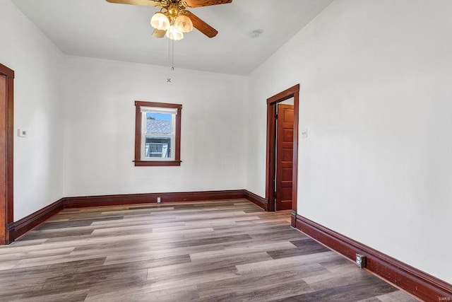 empty room featuring light hardwood / wood-style floors and ceiling fan