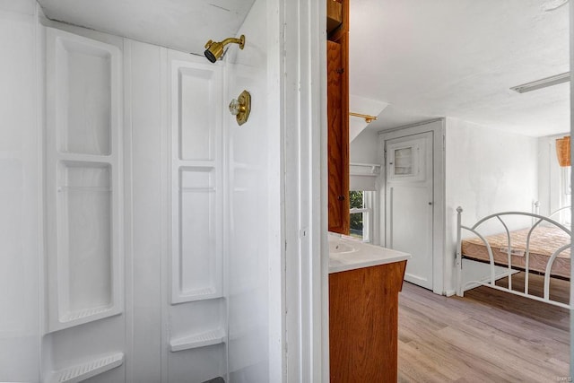 bathroom with hardwood / wood-style flooring