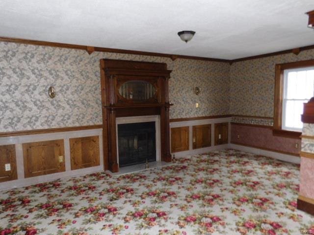 unfurnished living room featuring ornamental molding