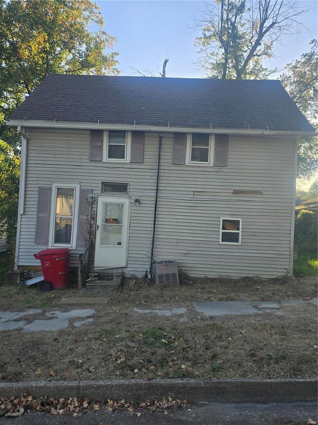 back of house with cooling unit