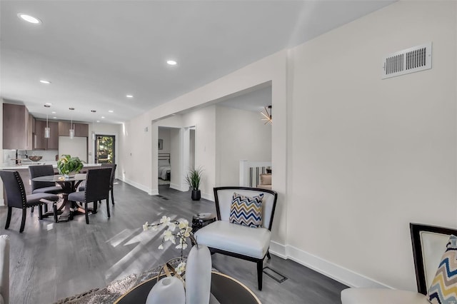 dining room with dark wood-type flooring