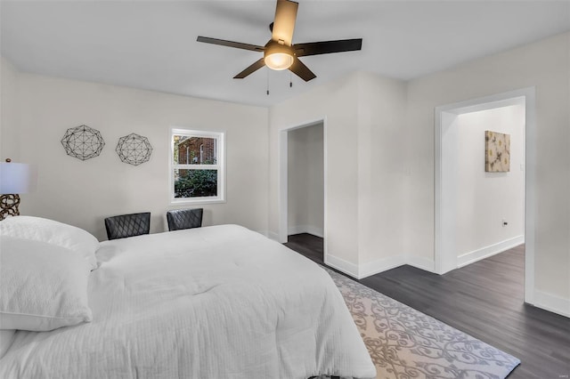 bedroom with ceiling fan and dark wood-type flooring