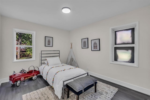 bedroom featuring dark hardwood / wood-style flooring