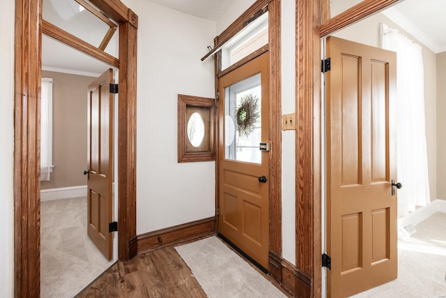 interior space featuring crown molding and hardwood / wood-style flooring