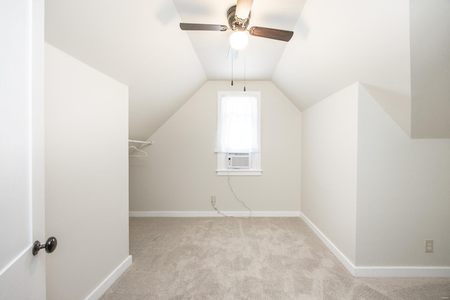 bonus room featuring ceiling fan, vaulted ceiling, and light colored carpet