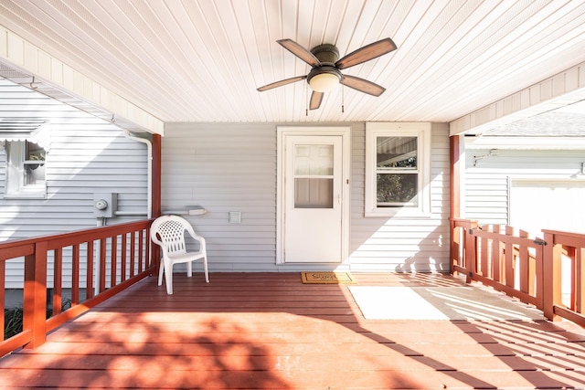 wooden terrace featuring ceiling fan