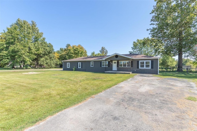 ranch-style house with a front yard